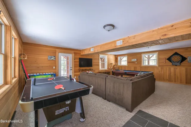 a living room with furniture and a rug