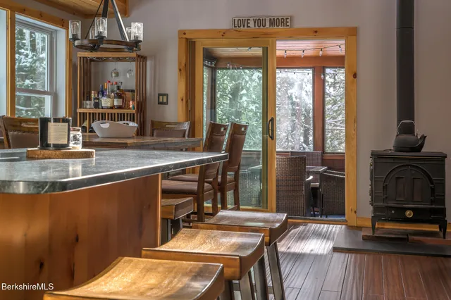 a dining table with chairs and wooden floor
