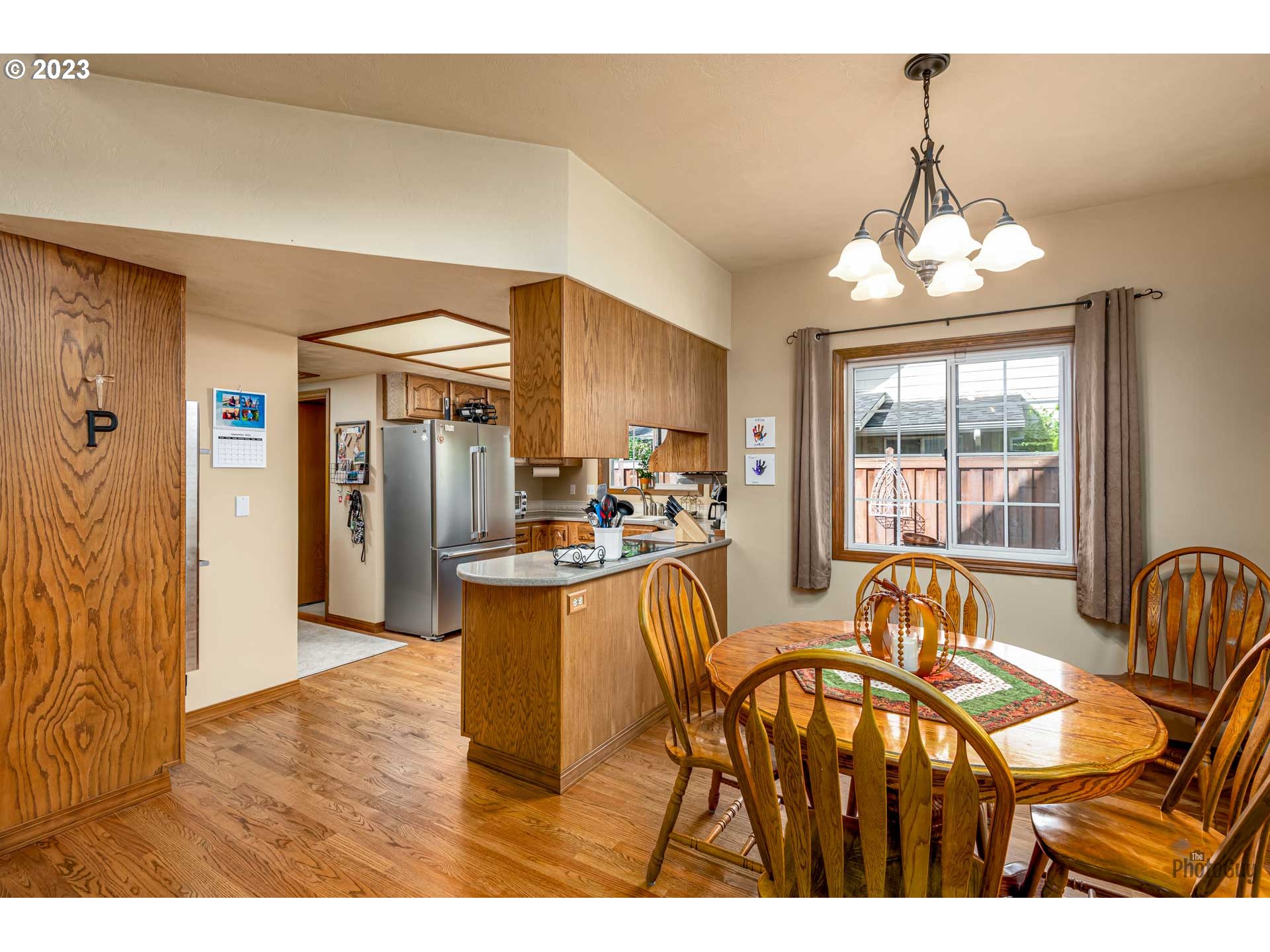 551 68th Place Springfield, OR 97478 - Photo 16 of 45 a view of a dining room with furniture window and outside view
