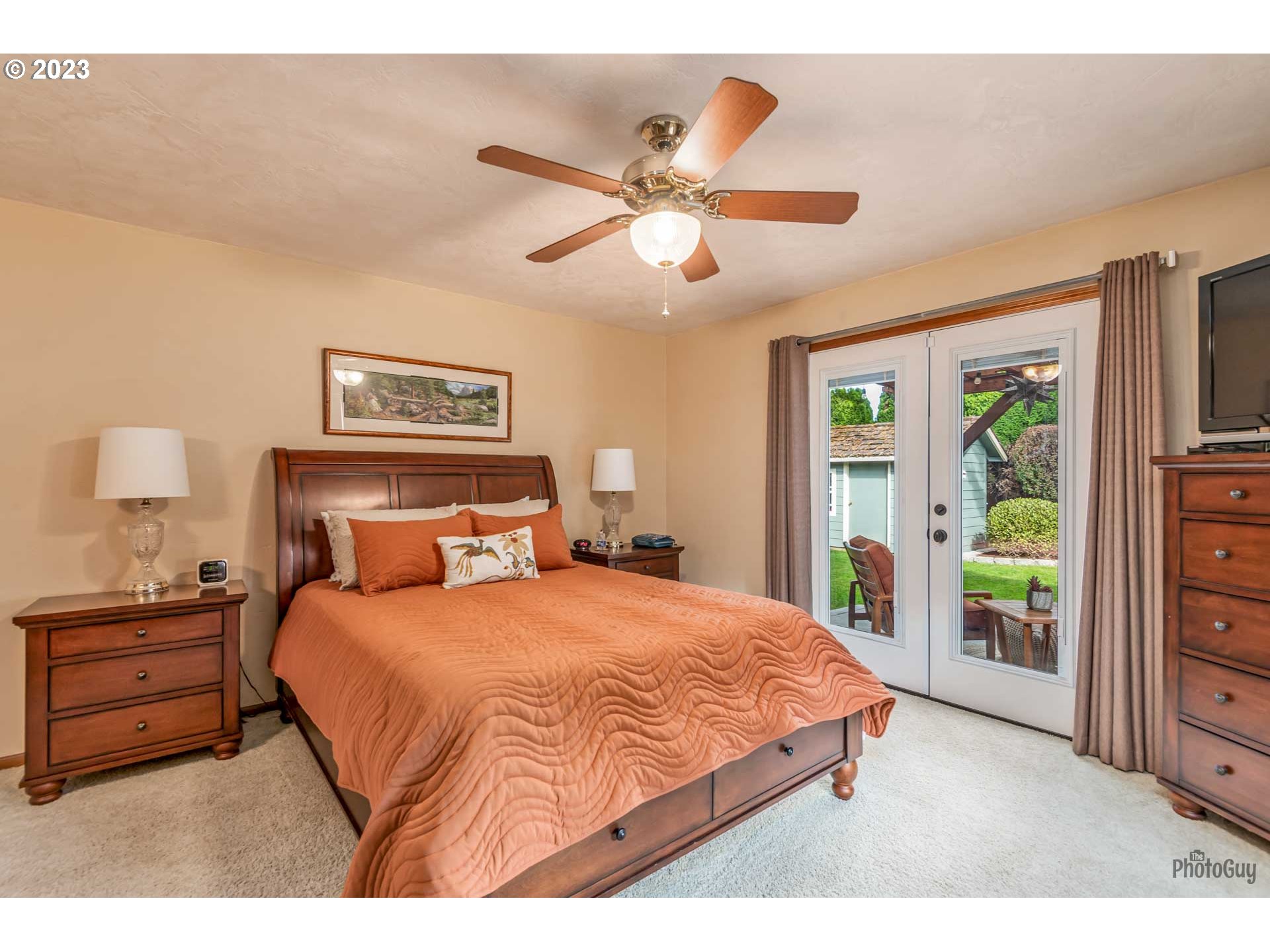 551 68th Place Springfield, OR 97478 - Photo 19 of 45 a bedroom with a bed and a chandelier