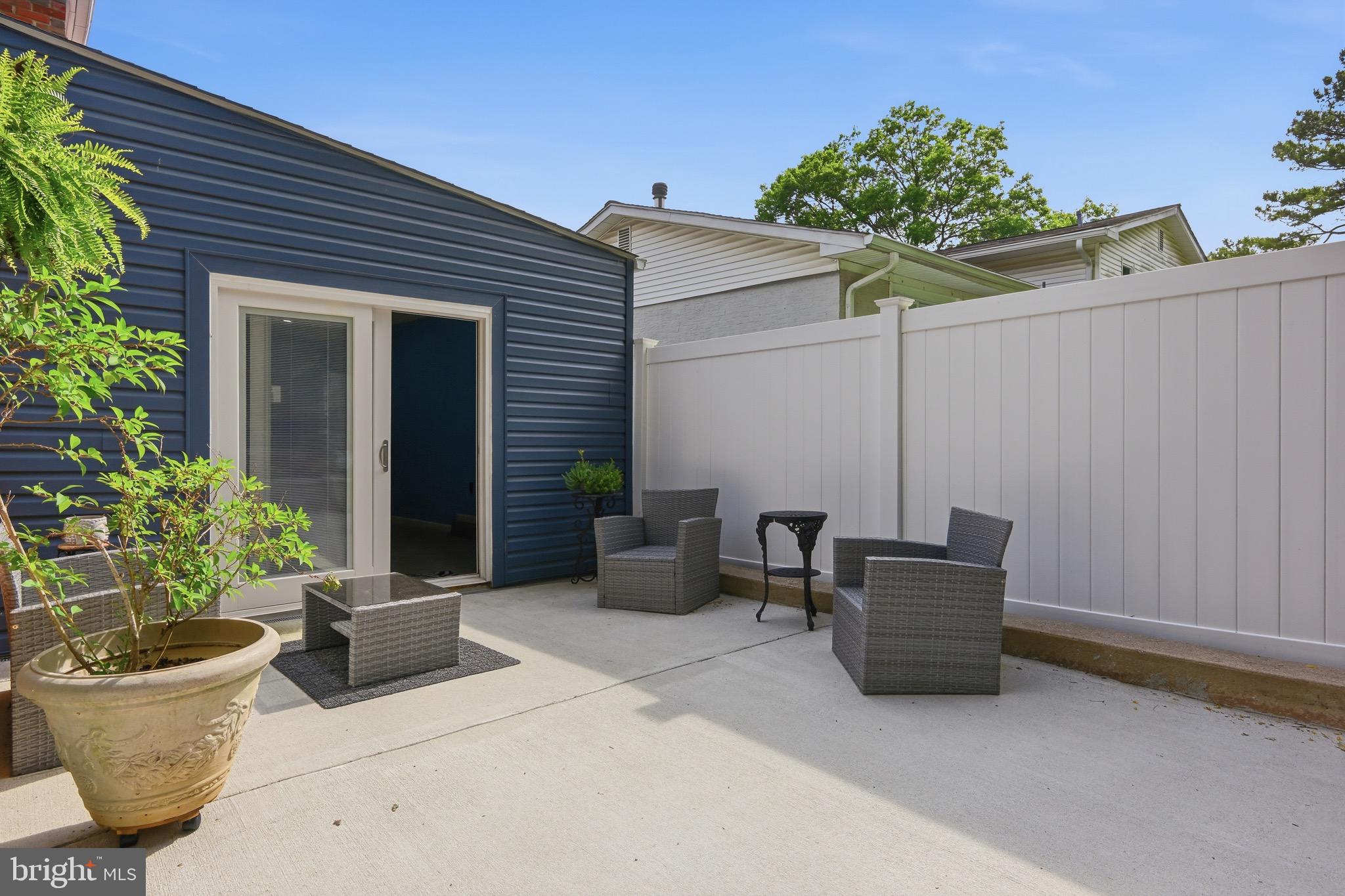 238 East Timonium Road Lutherville-Timonium, MD 21093 - Photo 3 of 40 a view of a patio with chairs and potted plants