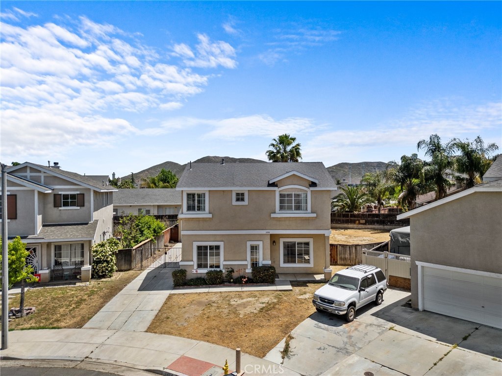 1494 Rabbit Peak Way Hemet, CA 92545 - Photo 1 of 1 a front view of a house with a garden