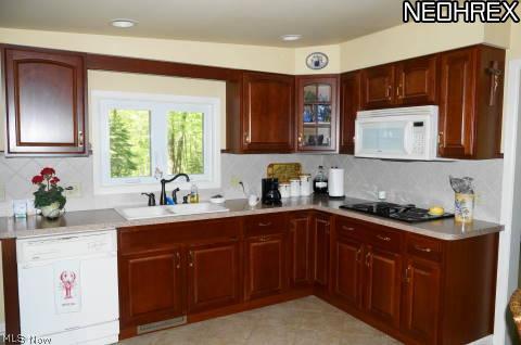 4542 Edson Road Kent, OH 44240 - Photo 2 of 25 Kitchen with newer cabinets and ceramic tile floor.