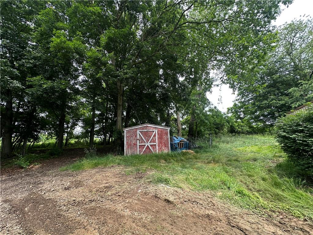 22 Howes Lane Fredericktown, PA 15333 - Photo 11 of 30 a sign that is sitting in front of a tree