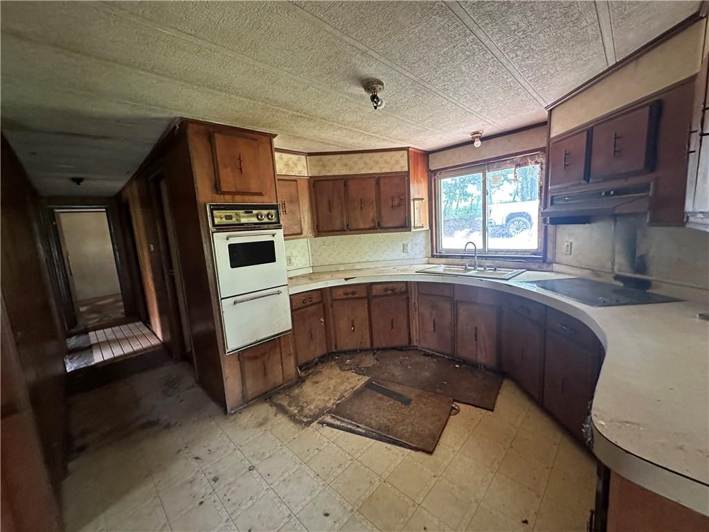 22 Howes Lane Fredericktown, PA 15333 - Photo 14 of 30 a kitchen with stainless steel appliances granite countertop a sink window and cabinets