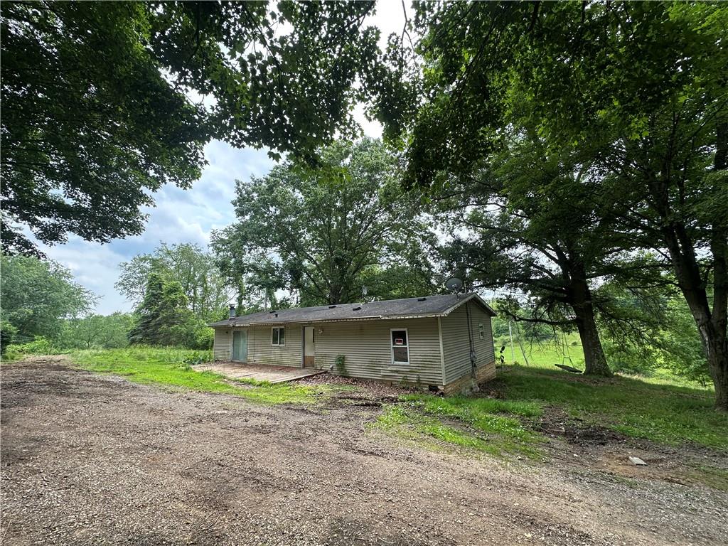 22 Howes Lane Fredericktown, PA 15333 - Photo 2 of 30 a view of a house with a yard and large tree