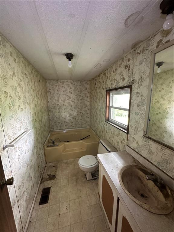 22 Howes Lane Fredericktown, PA 15333 - Photo 26 of 30 a bathroom with a sink a toilet and a tub