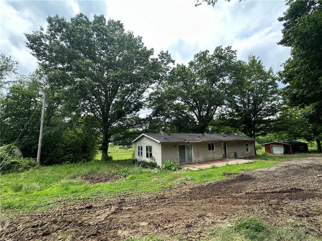 22 Howes Lane Fredericktown, PA 15333 - Photo 3 of 30 a front view of a house with garden