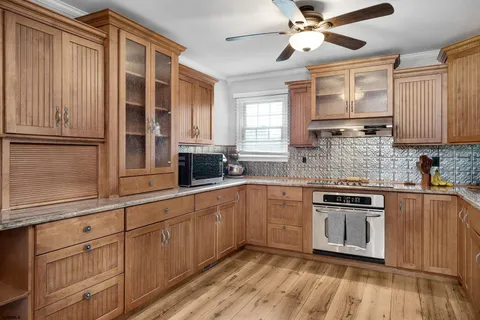 a kitchen with stainless steel appliances granite countertop a stove and a sink