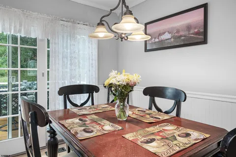 a view of a kitchen counter with a stove a microwave and cabinets