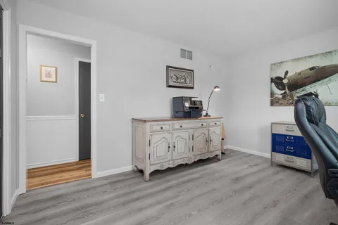 a bathroom with a shower curtain and a toilet