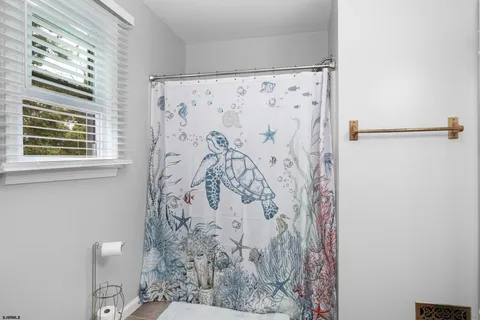 a dining room with a sink and a mirror