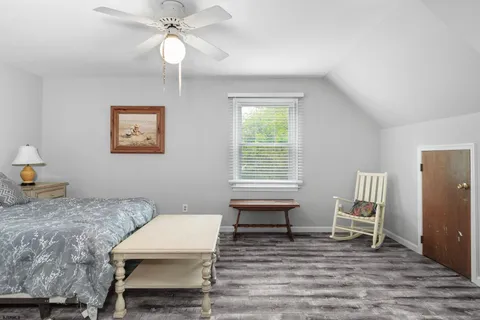 a bed room with a bed and a chandelier