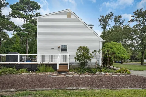 a view of a dinning table and chairs in patio