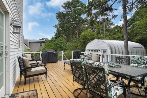 an aerial view of a house with a yard and lake view