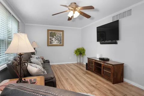 a room with furniture and a flat screen tv