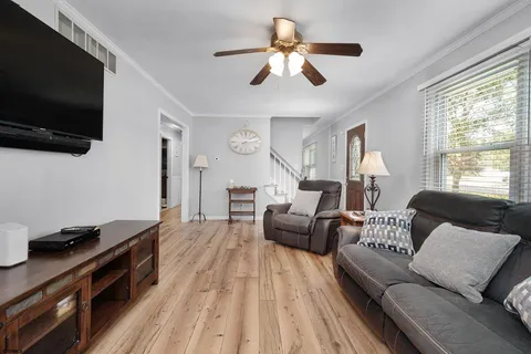 a living room with furniture and a flat screen tv