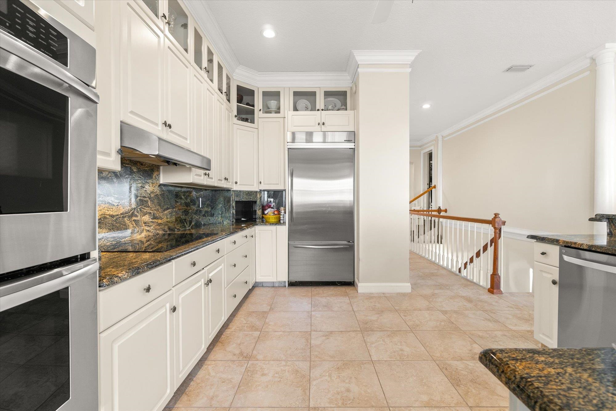 5042 Atlantic View St. Augustine, FL 32080 - Photo 13 of 72 Kitchen with appliances with stainless steel finishes, decorative backsplash, recessed lighting, under cabinet range hood, and crown molding