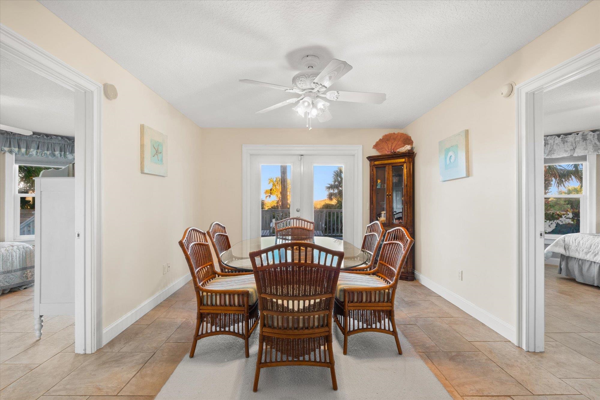 5042 Atlantic View St. Augustine, FL 32080 - Photo 16 of 72 Dining space with french doors, a ceiling fan, and a textured ceiling
