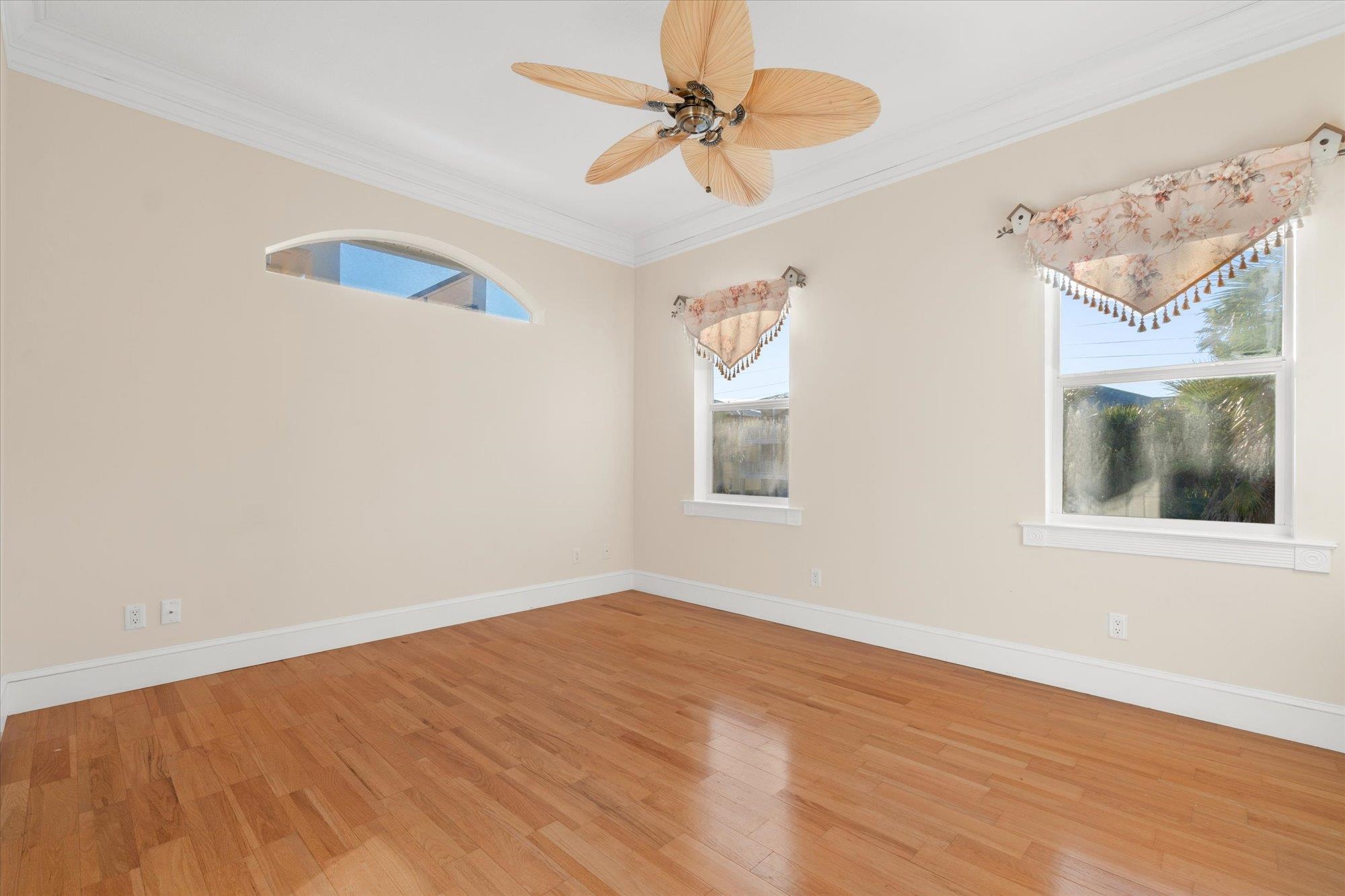 5042 Atlantic View St. Augustine, FL 32080 - Photo 26 of 72 Unfurnished room featuring crown molding, light wood-type flooring, and ceiling fan