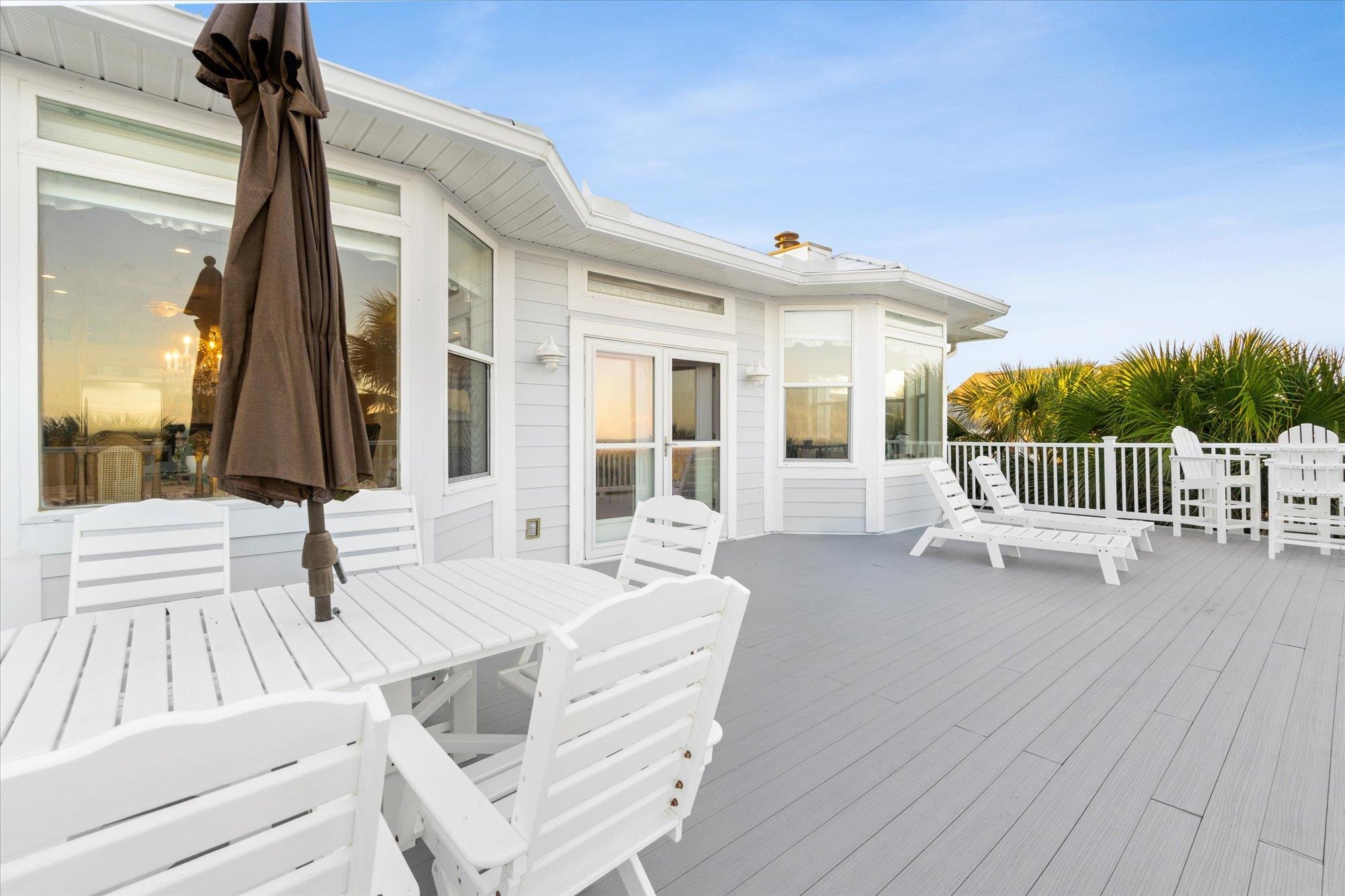5042 Atlantic View St. Augustine, FL 32080 - Photo 38 of 72 Wooden terrace with outdoor dining area