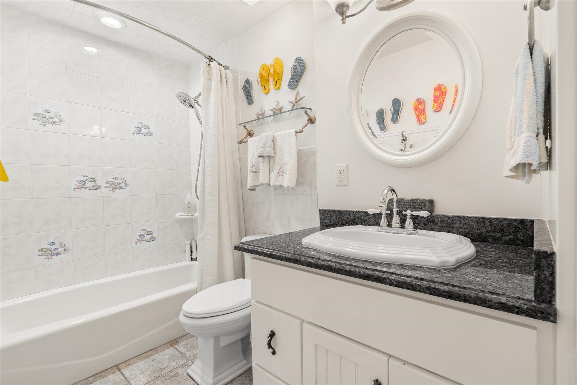 5042 Atlantic View St. Augustine, FL 32080 - Photo 43 of 72 Bathroom featuring vanity and shower / bath combo with shower curtain