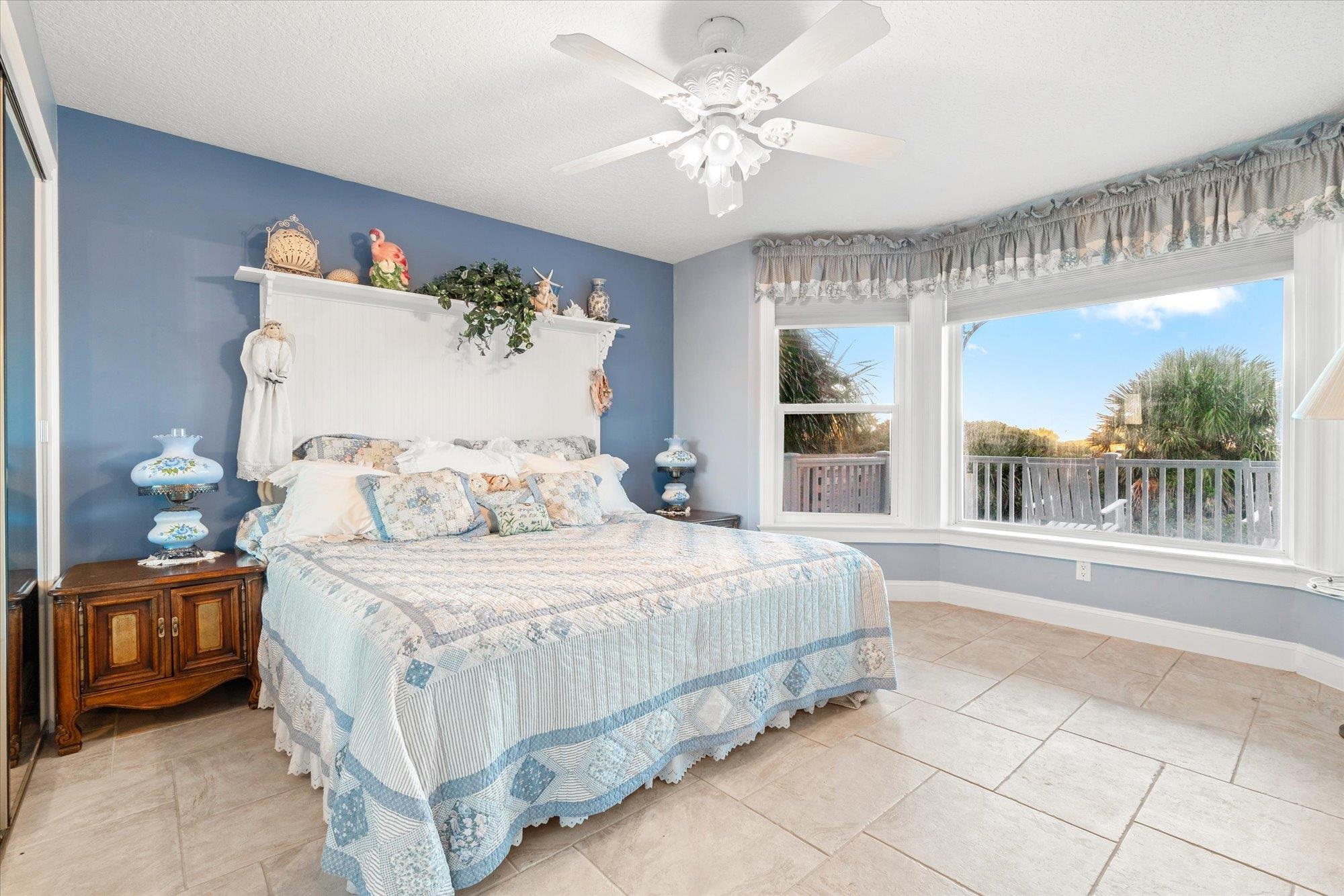 5042 Atlantic View St. Augustine, FL 32080 - Photo 46 of 72 Bedroom featuring a ceiling fan, light tile patterned floors, and a textured ceiling