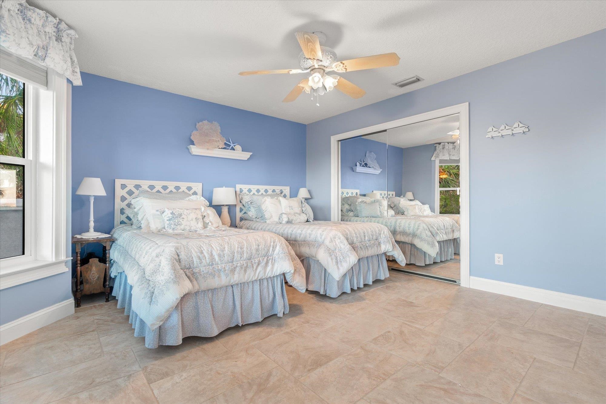 5042 Atlantic View St. Augustine, FL 32080 - Photo 49 of 72 Bedroom featuring a ceiling fan and a closet