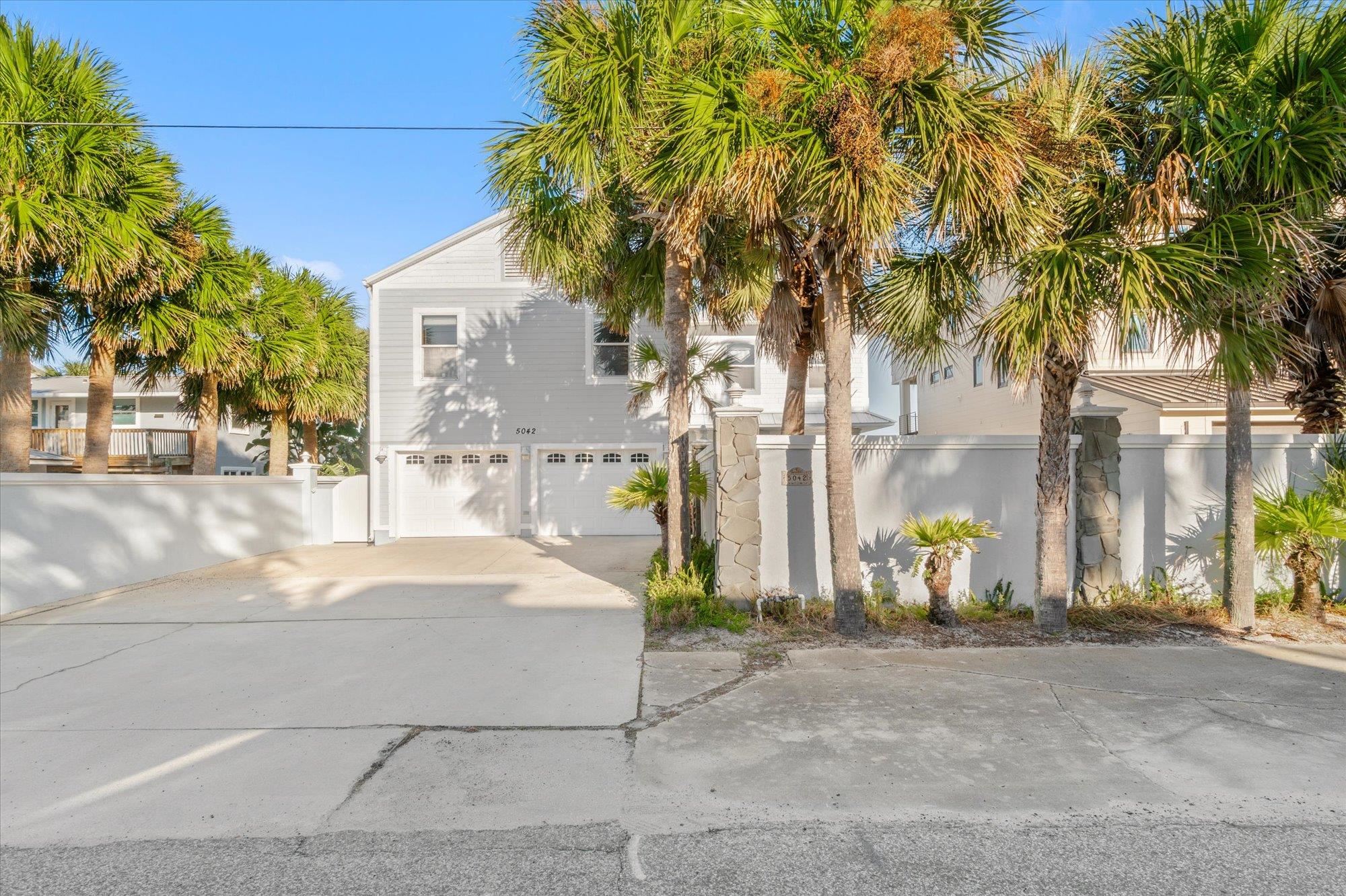 5042 Atlantic View St. Augustine, FL 32080 - Photo 53 of 72 View of side of home featuring driveway and a garage