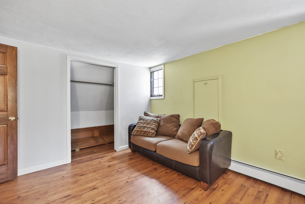 28 Adams Road Hubbardston, MA 01452 - Photo 20 of 35 a living room with furniture and a wooden floor
