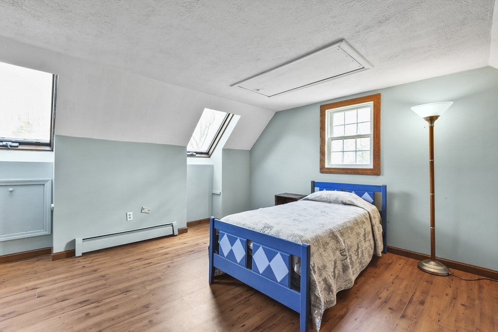 28 Adams Road Hubbardston, MA 01452 - Photo 23 of 35 a bedroom with a bed and window