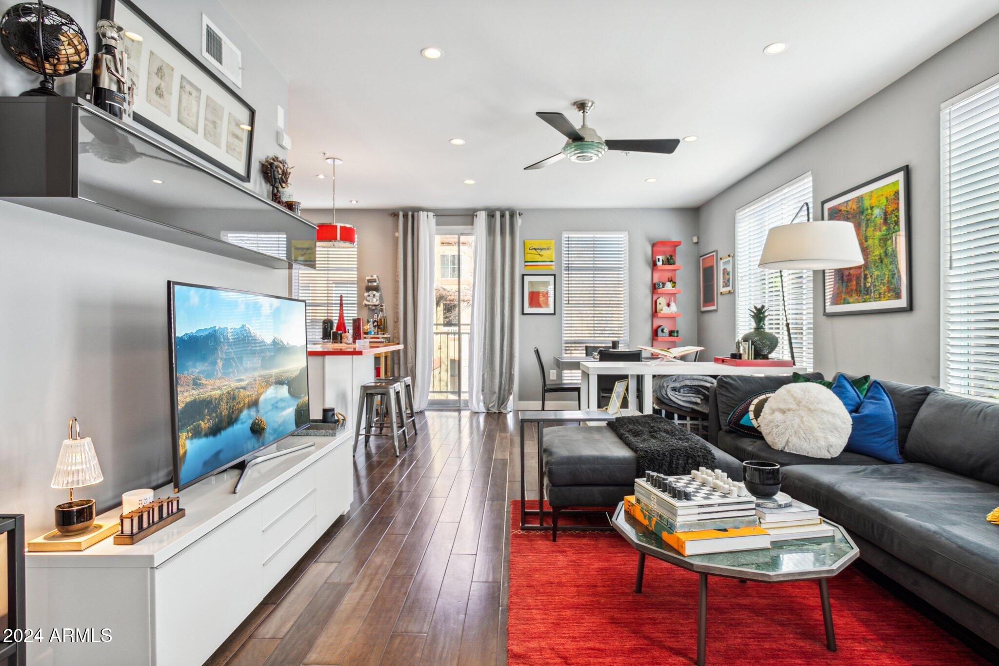 1920 East Bell Road, Unit 1161 Phoenix, AZ 85022 - Photo 1 of 37 a living room with furniture and a flat screen tv