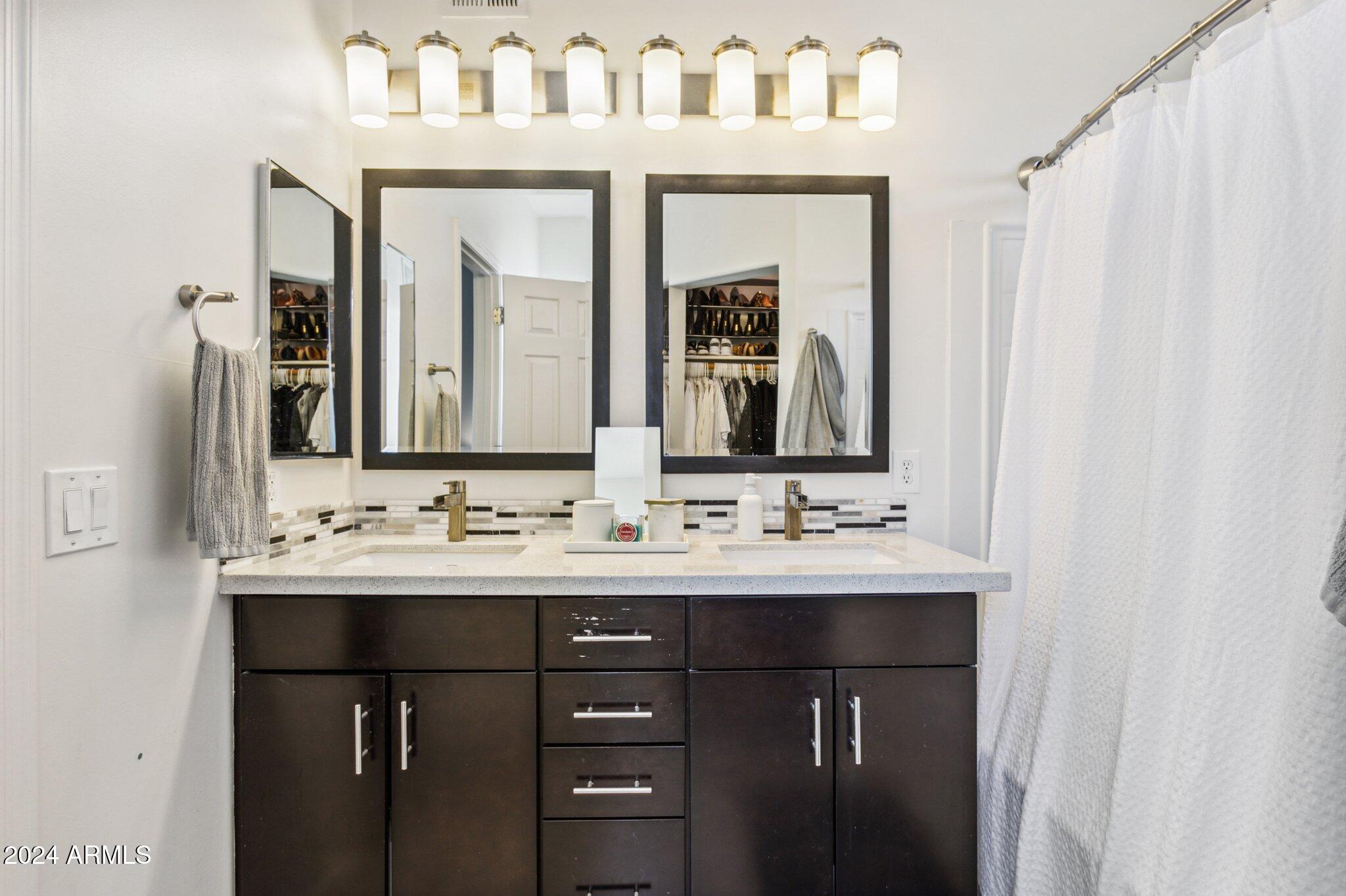 1920 East Bell Road, Unit 1161 Phoenix, AZ 85022 - Photo 16 of 37 a bathroom with a sink and a mirror