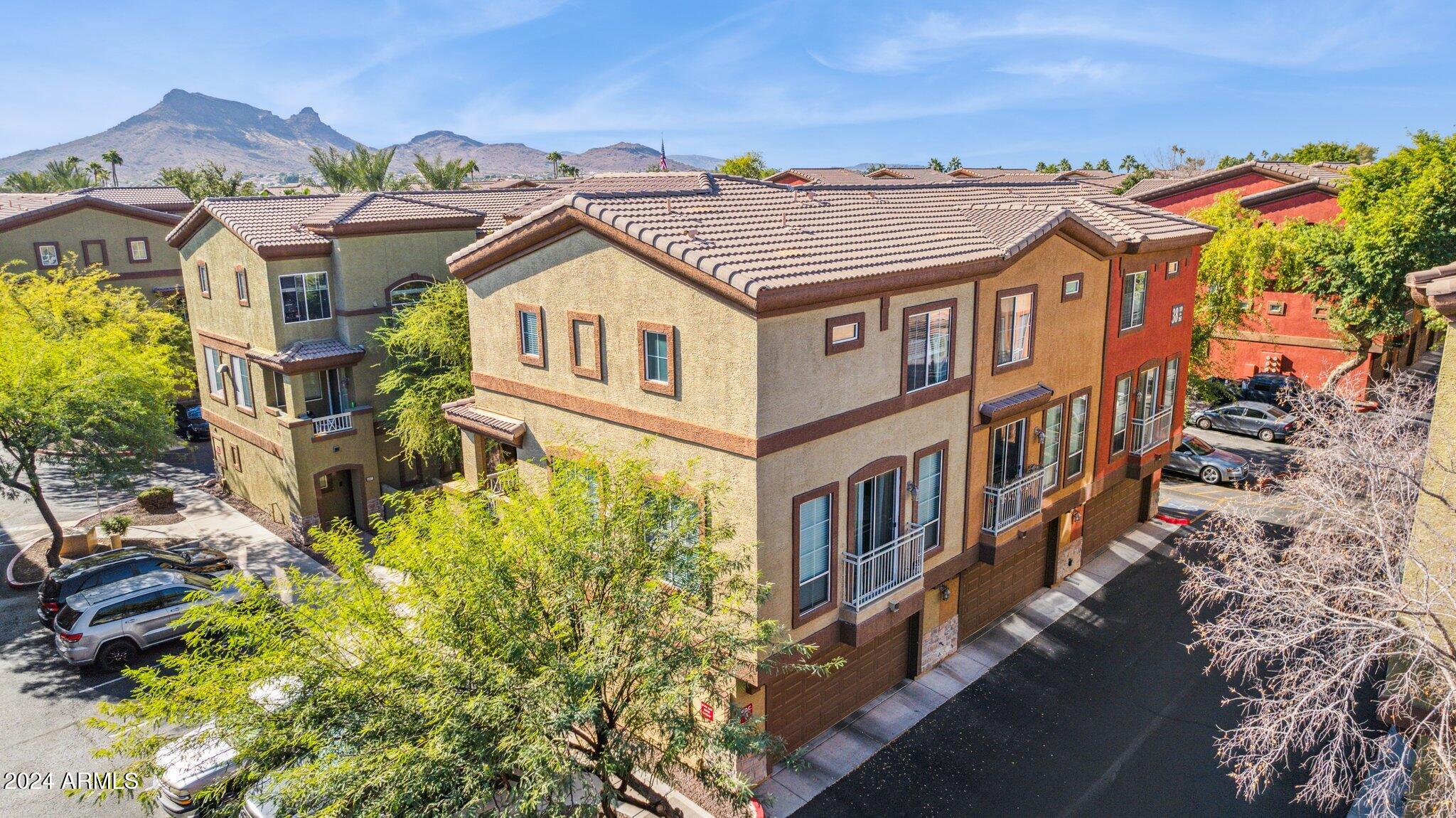 1920 East Bell Road, Unit 1161 Phoenix, AZ 85022 - Photo 29 of 37 an aerial view of a house with a yard and balcony