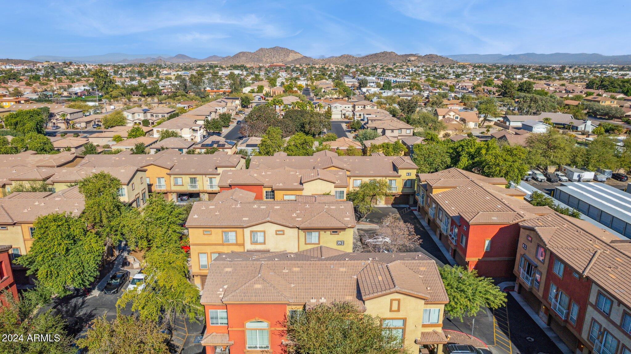1920 East Bell Road, Unit 1161 Phoenix, AZ 85022 - Photo 33 of 37 an aerial view of residential houses with outdoor space
