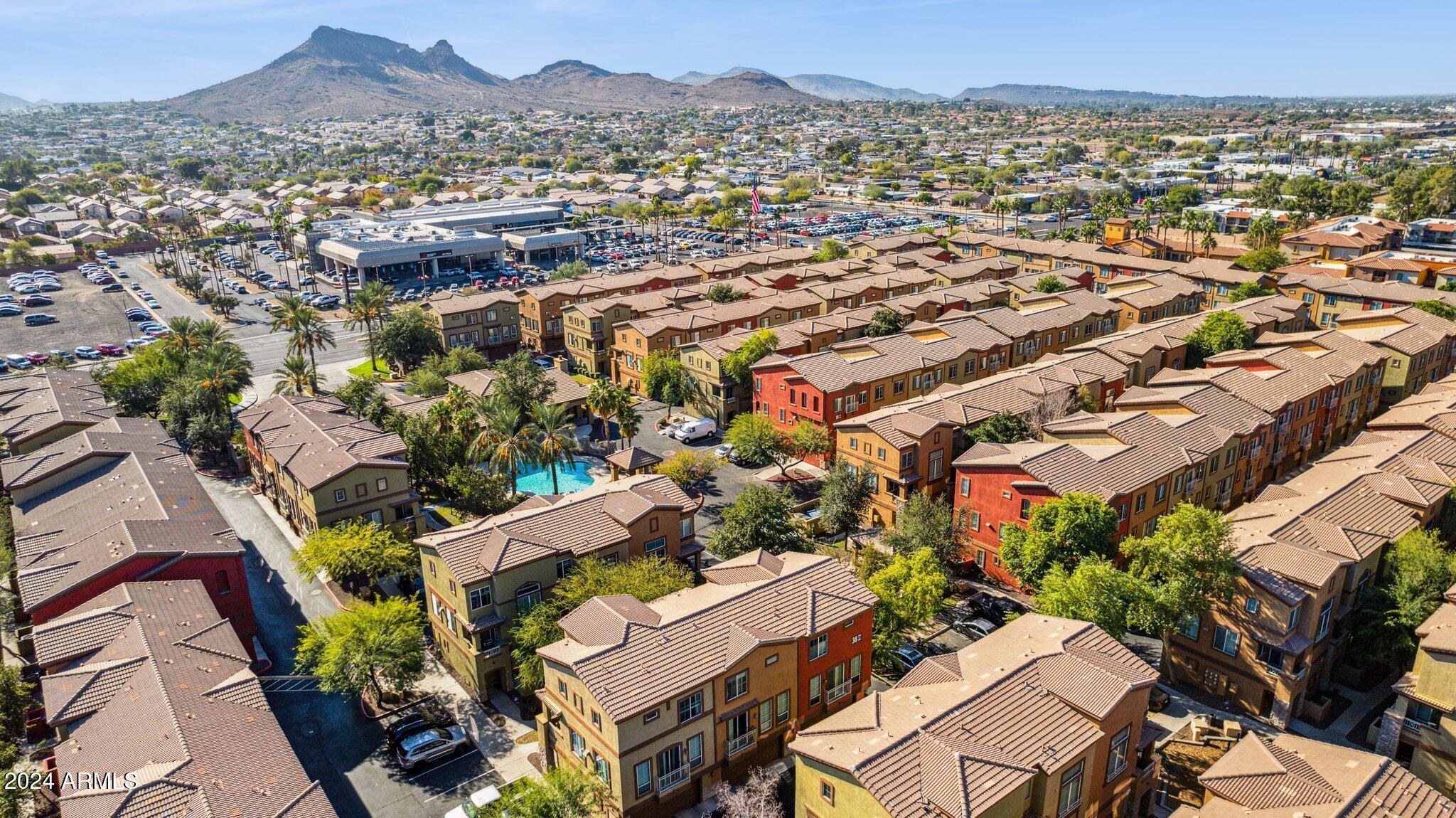 1920 East Bell Road, Unit 1161 Phoenix, AZ 85022 - Photo 34 of 37 an aerial view of a city with lots of residential buildings