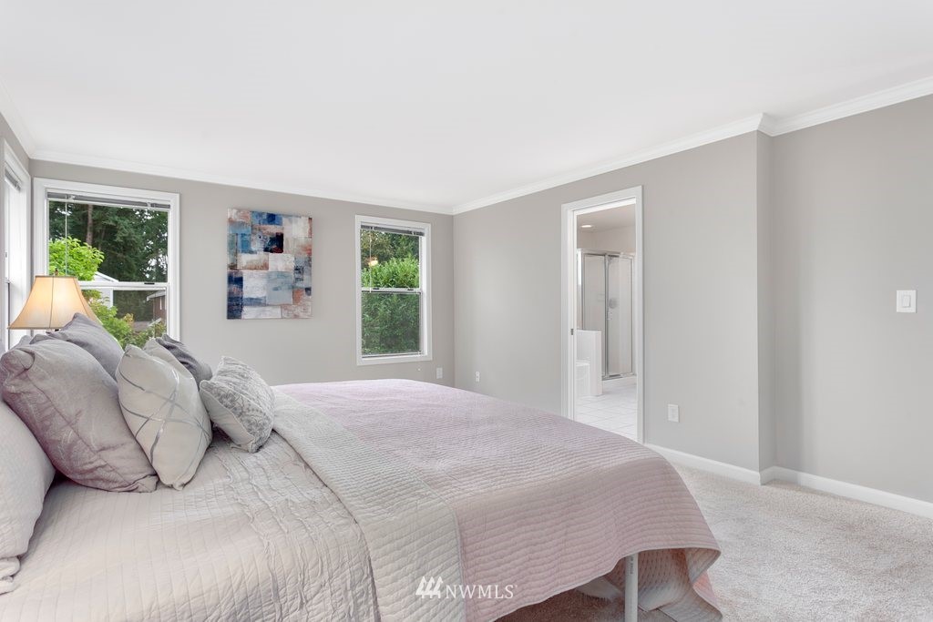 4513 Northeast 18th Street Renton, WA 98059 - Photo 14 of 25 a bedroom with a large bed and a window
