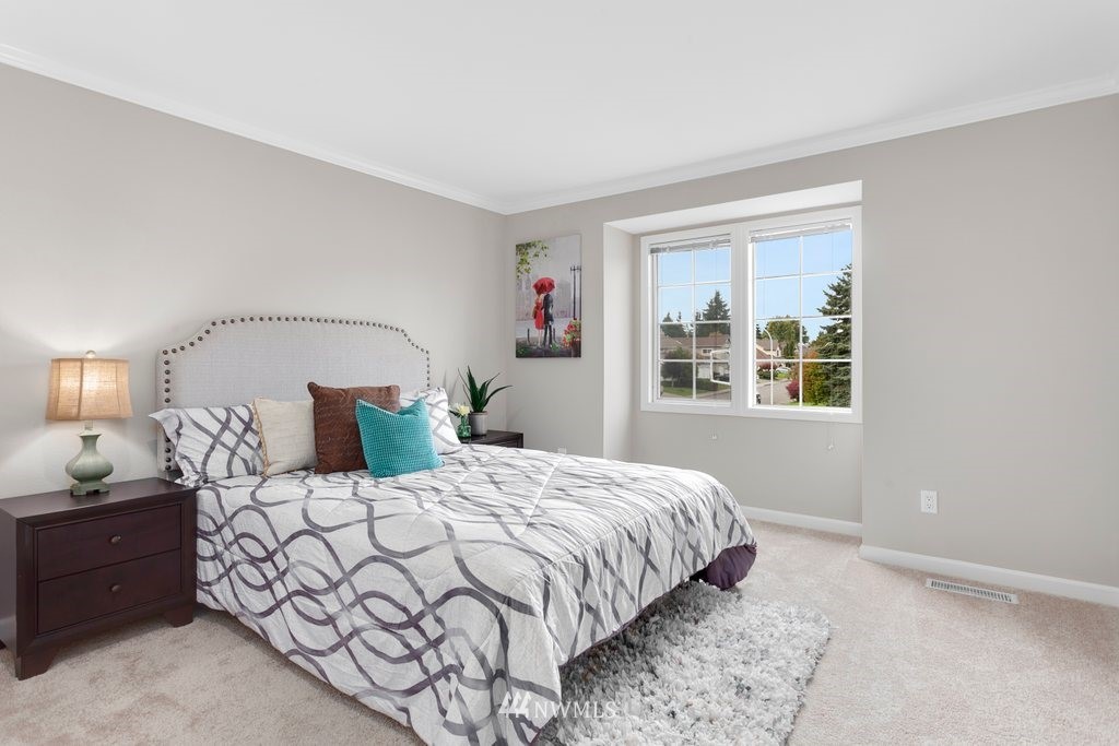 4513 Northeast 18th Street Renton, WA 98059 - Photo 17 of 25 a bedroom with a bed and a window