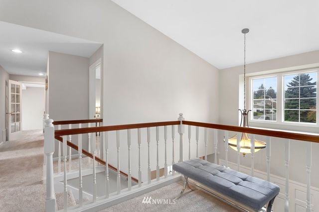 a view of staircase with sitting area