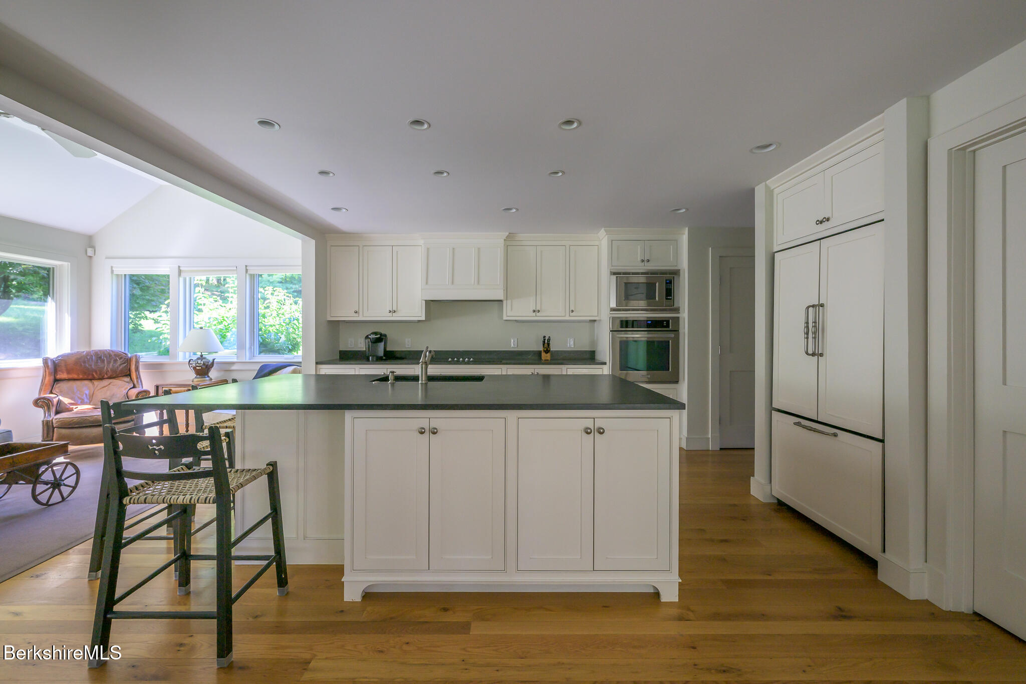 91 North Undermountain Road Egremont, MA 01230 - Photo 14 of 64 a kitchen with granite countertop a refrigerator and white cabinets
