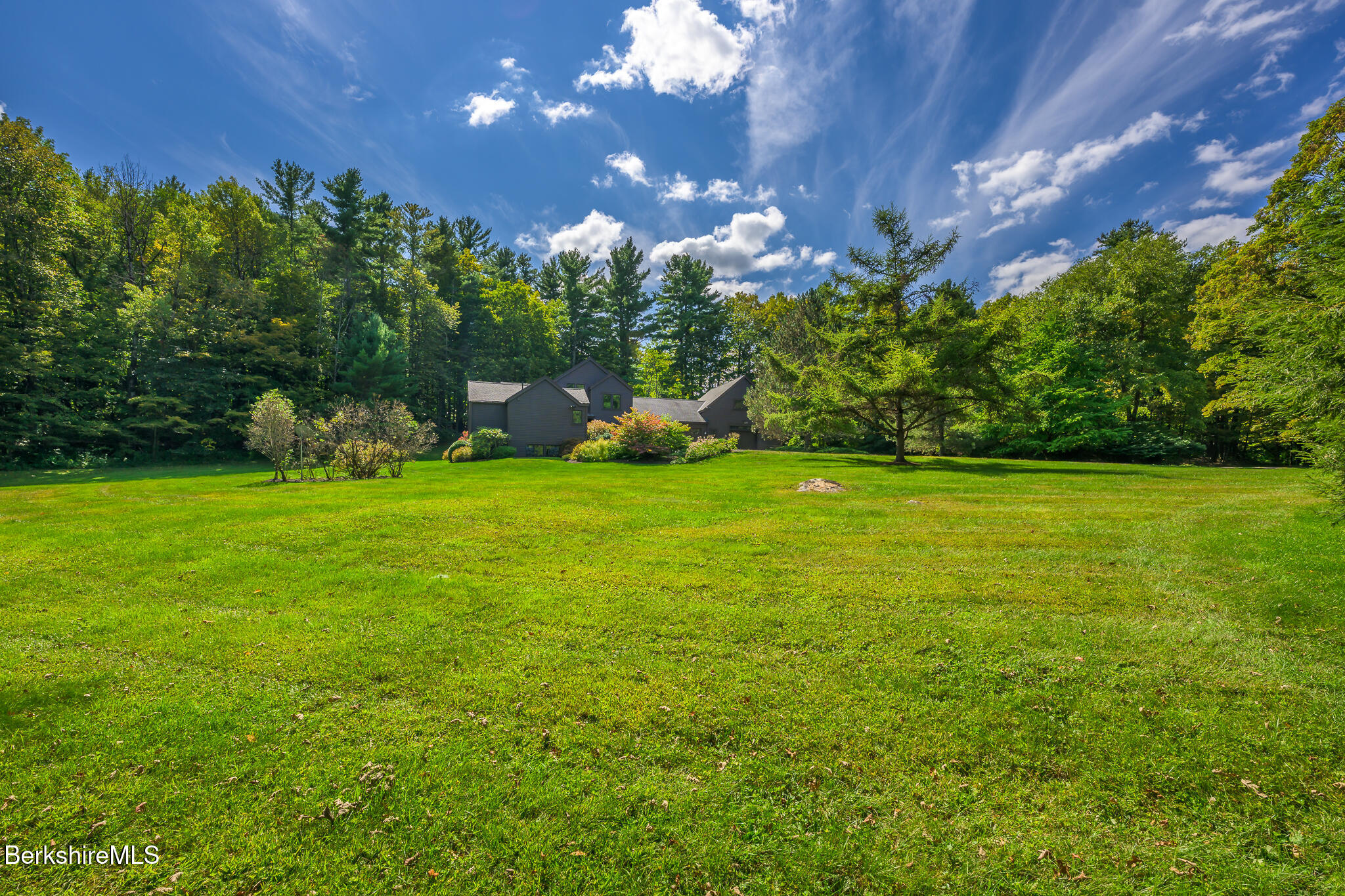 91 North Undermountain Road Egremont, MA 01230 - Photo 2 of 64 a view of a golf course with a lake