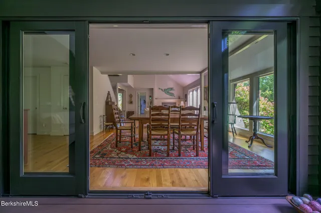 a living room filled with furniture and a window