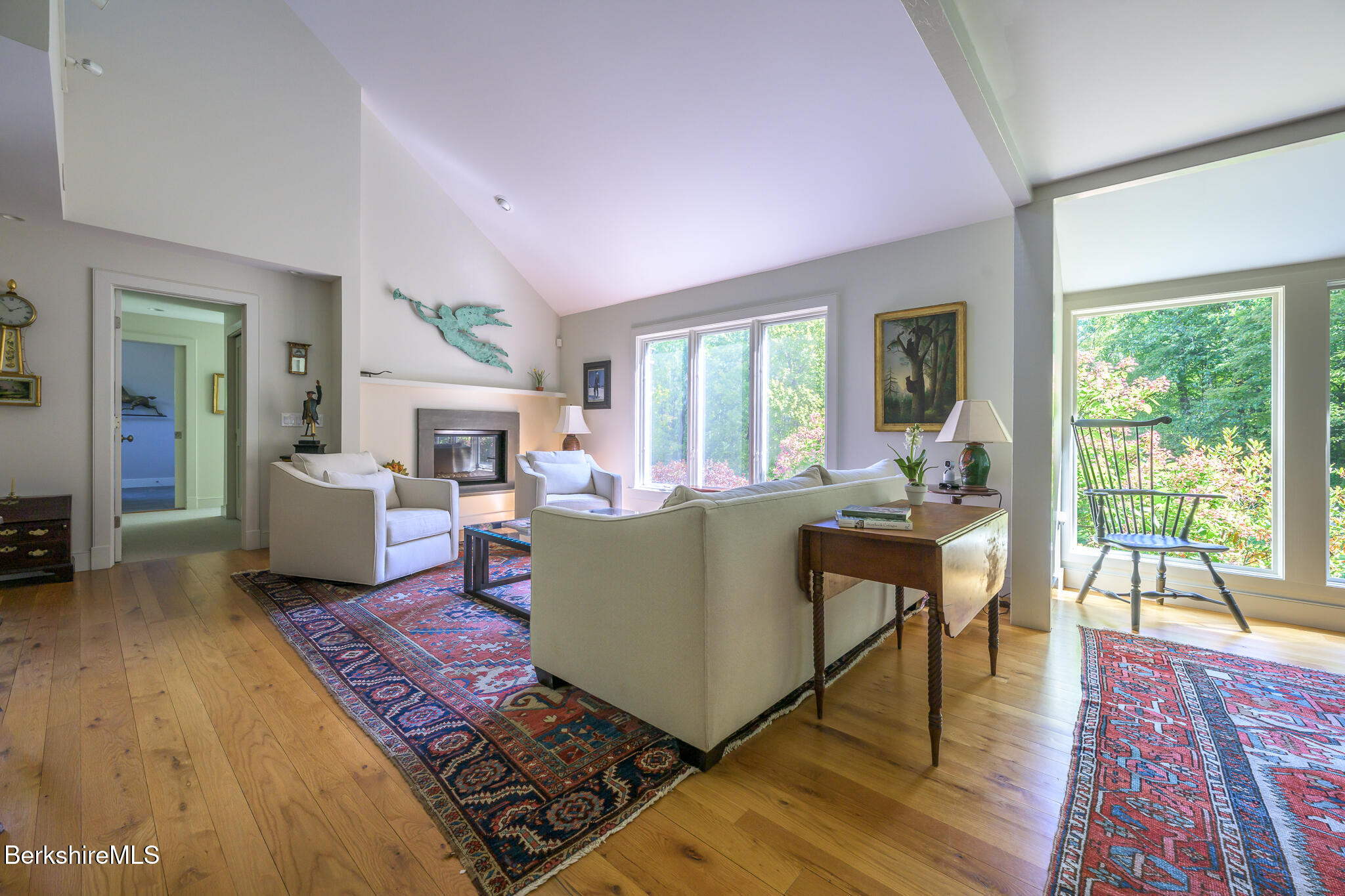 91 North Undermountain Road Egremont, MA 01230 - Photo 32 of 64 a living room with furniture a large window wooden floor and a rug
