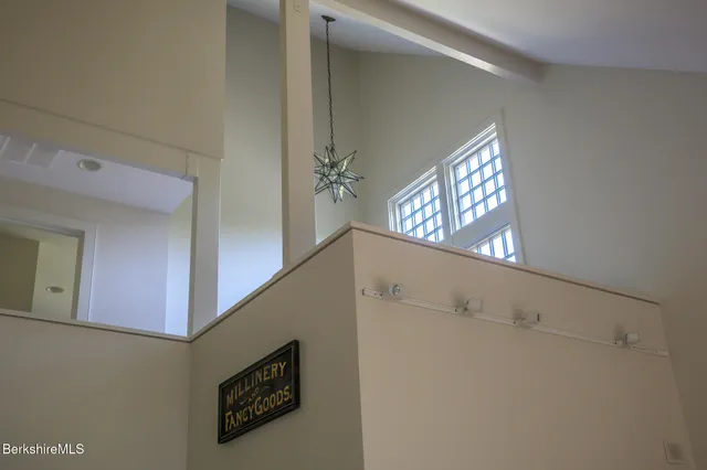 a living room with furniture and a book shelf