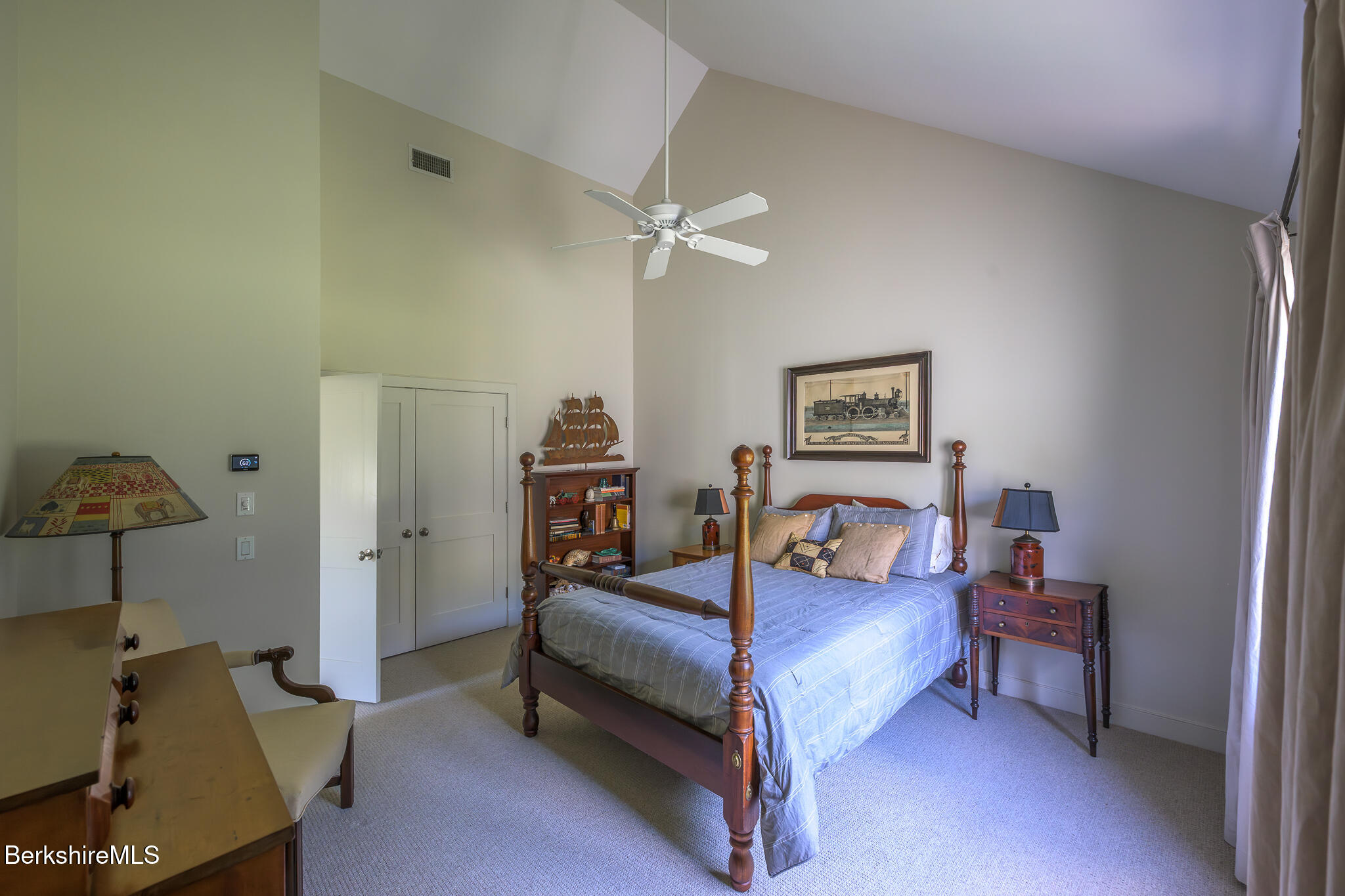 91 North Undermountain Road Egremont, MA 01230 - Photo 47 of 64 a bedroom with a bed and a chandelier