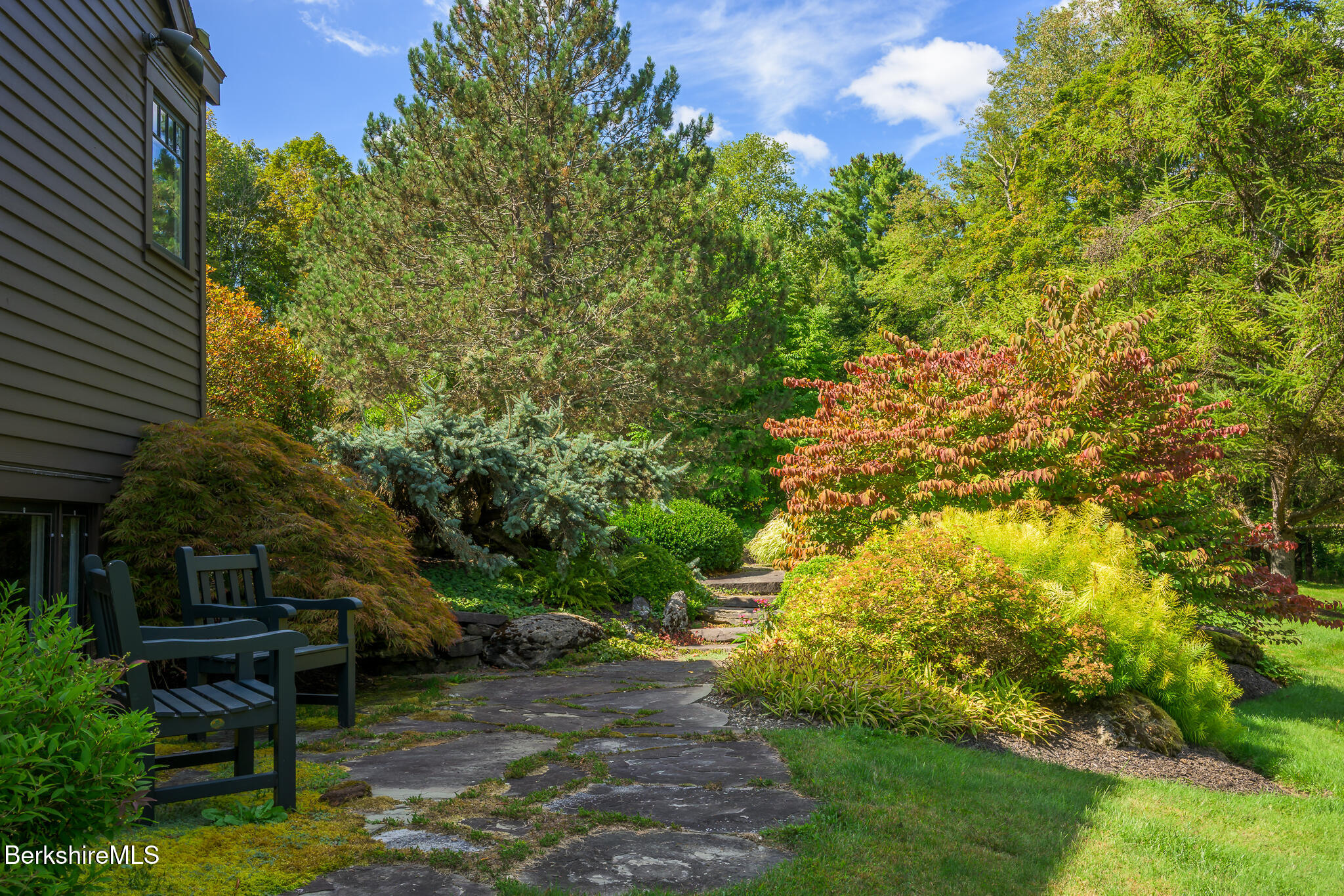 91 North Undermountain Road Egremont, MA 01230 - Photo 6 of 64 a backyard of a house with table and chairs