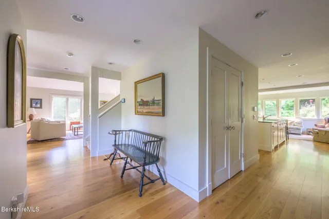 a kitchen with counter top space and wooden floor