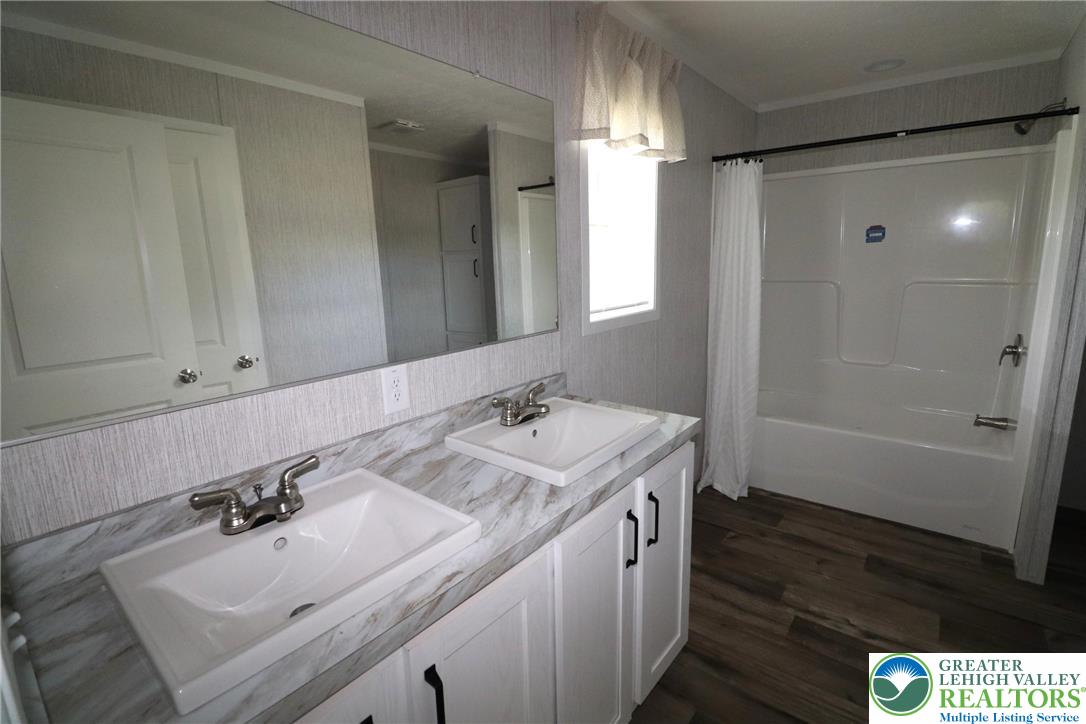 5020 Old Timber Road Stroudsburg, PA 18360 - Photo 15 of 32 a bathroom with a sink a toilet and shower