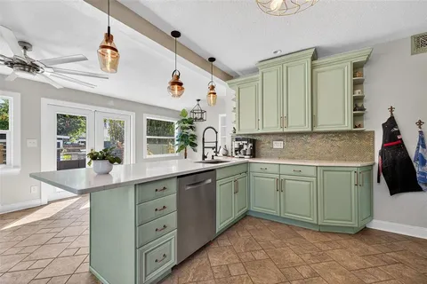 a kitchen with a sink and cabinets