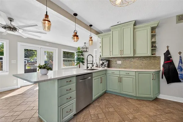 a kitchen with a sink and cabinets